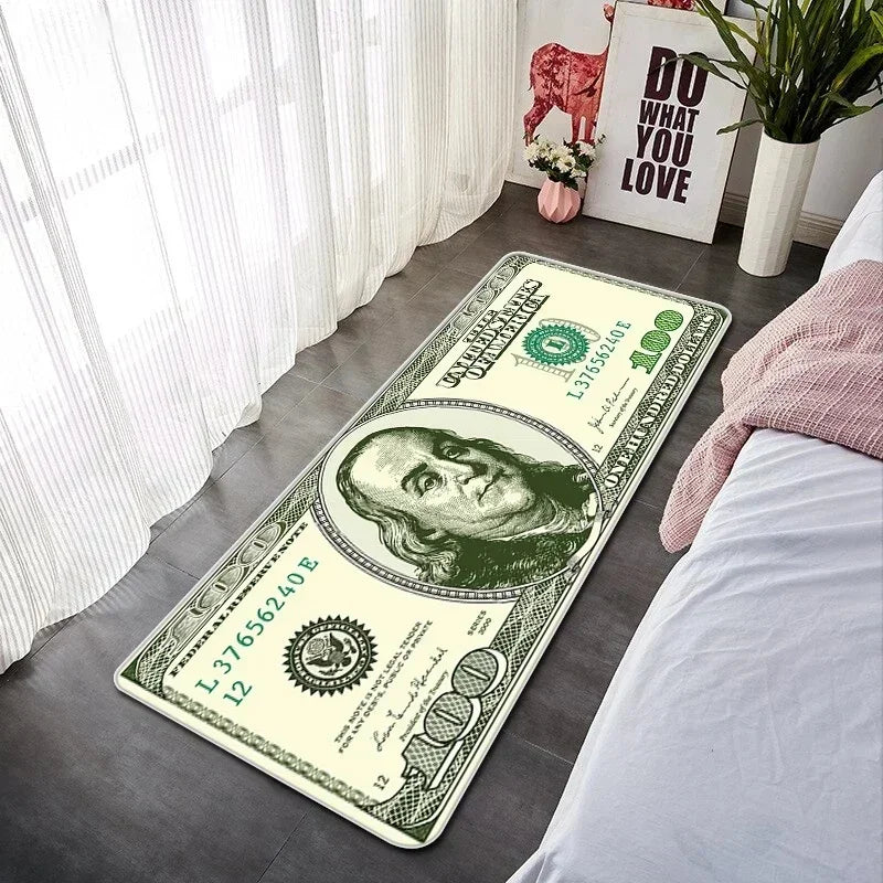 A green banknote pattern anti-slip soft floor mat placed on a gray floor next to a bed.