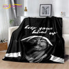 A black throw blanket featuring a portrait of Eminem and 2Pac with the text keep your head up