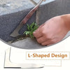 Close-up of a stainless steel L-shaped garden weeder being used to remove weeds from a concrete surface.