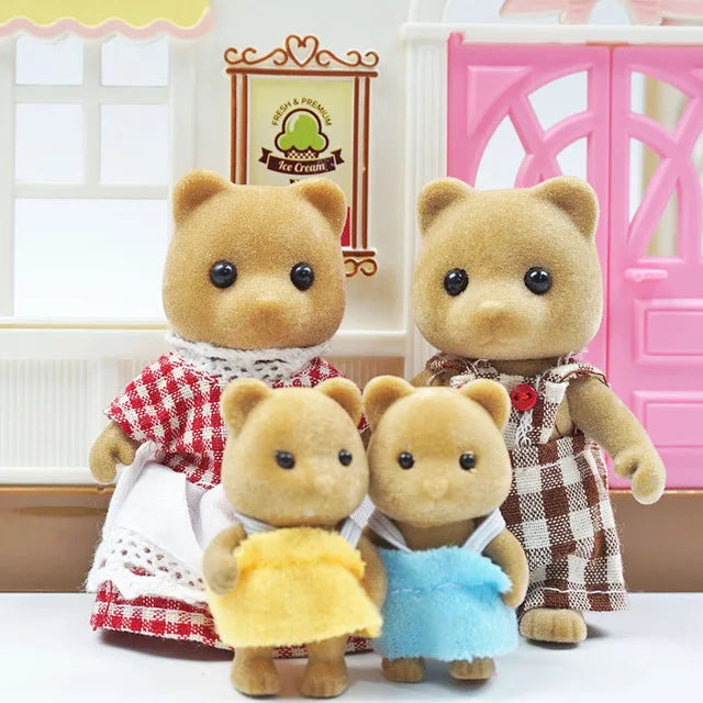 Two fluffy brown bear miniature dolls dressed in rustic clothing standing in front of a pink cabinet.