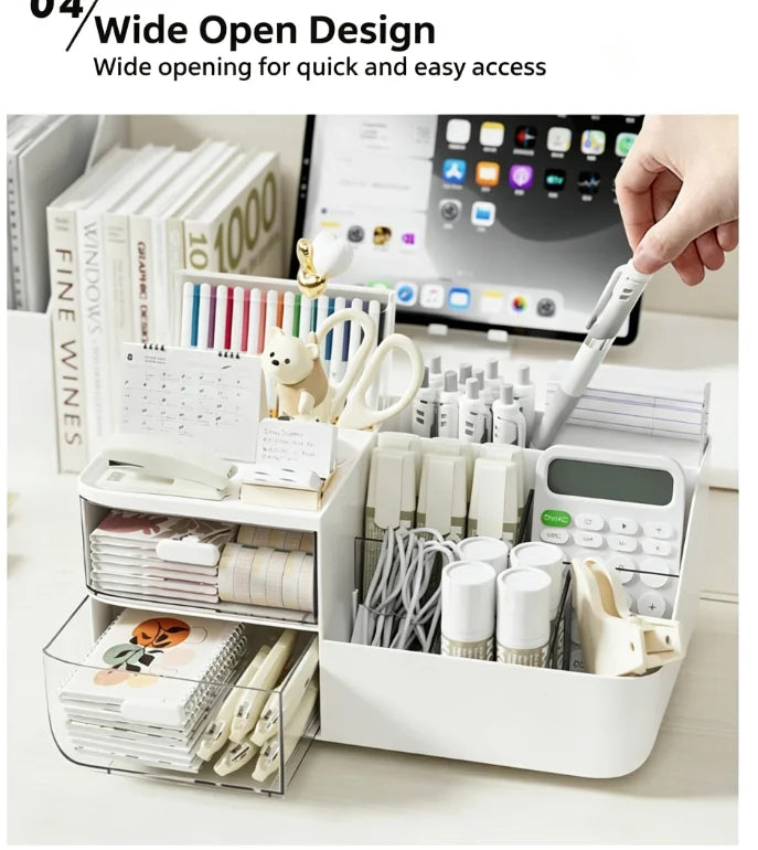 A white desk organizer with transparent drawers holds various stationery and office supplies.