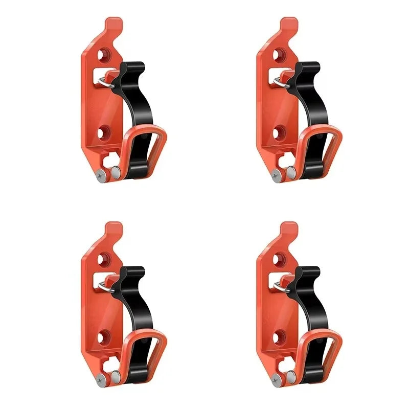 A pair of heavy-duty orange wall mount tool holders designed for securing shovels, axes, and other tools.