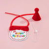 A red pet birthday party hat and bib set for cats and small dogs with a happy birthday message