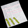 A stack of white mesh laundry bags with pink trim, showing various sizes like 50x60cm and 40x50cm.