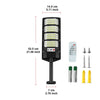 A black solar wall light fixture with multiple LED panels and a motion sensor, shown with accessories.