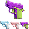 A collection of three mini 3D printed gravity fidget pistols in light blue, pink, and purple.