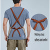 A man wearing a gray t-shirt and khaki pants with brown webbing straps tied in a bow, demonstrating the waterproof adjustable