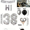 A kit for creating a balloon garland featuring silver and black foil numbers and balloons.
