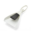 A white compact mini broom and dustpan set with a handle and bristles for cleaning desks and keyboards.