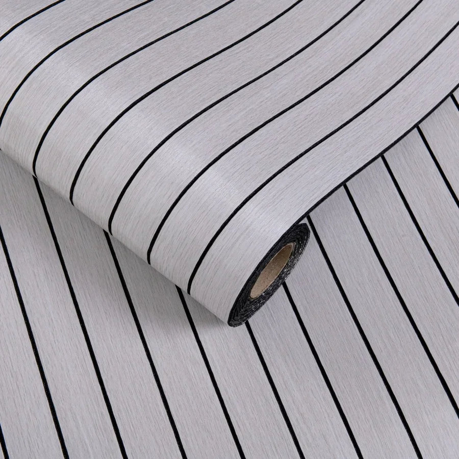 Roll of 3D grille pattern peel-and-stick wallpaper showing vertical black lines on a light gray background
