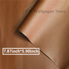 Close-up of a brown leather material showing a stitched edge and size dimensions 7.87in x 5.90in