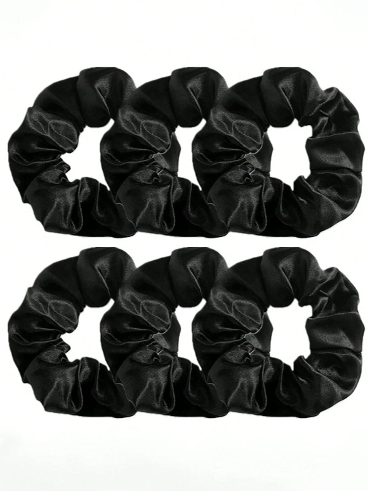 Une paire de pinces pour cheveux en satin noir, vue en dessus.