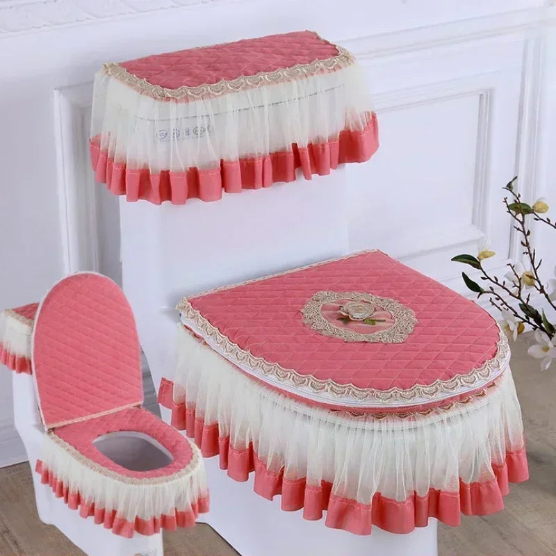 A set of pink and white antibacterial toilet seat covers with washable cushions displayed on a white stand.