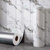 Roll of self-adhesive marble wall sticker featuring gray and gold veining on a white background