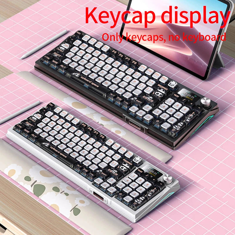 A close-up view of a pudding keycap set featuring cute pastel designs displayed on a tablet.