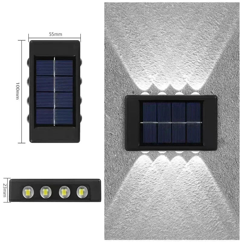 A rectangular solar powered outdoor wall light with an upper and downward illumination pattern shown against a gray wall.