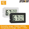 A white and black digital thermometer and hygrometer displaying 67 degrees and 24.3 degrees Celsius