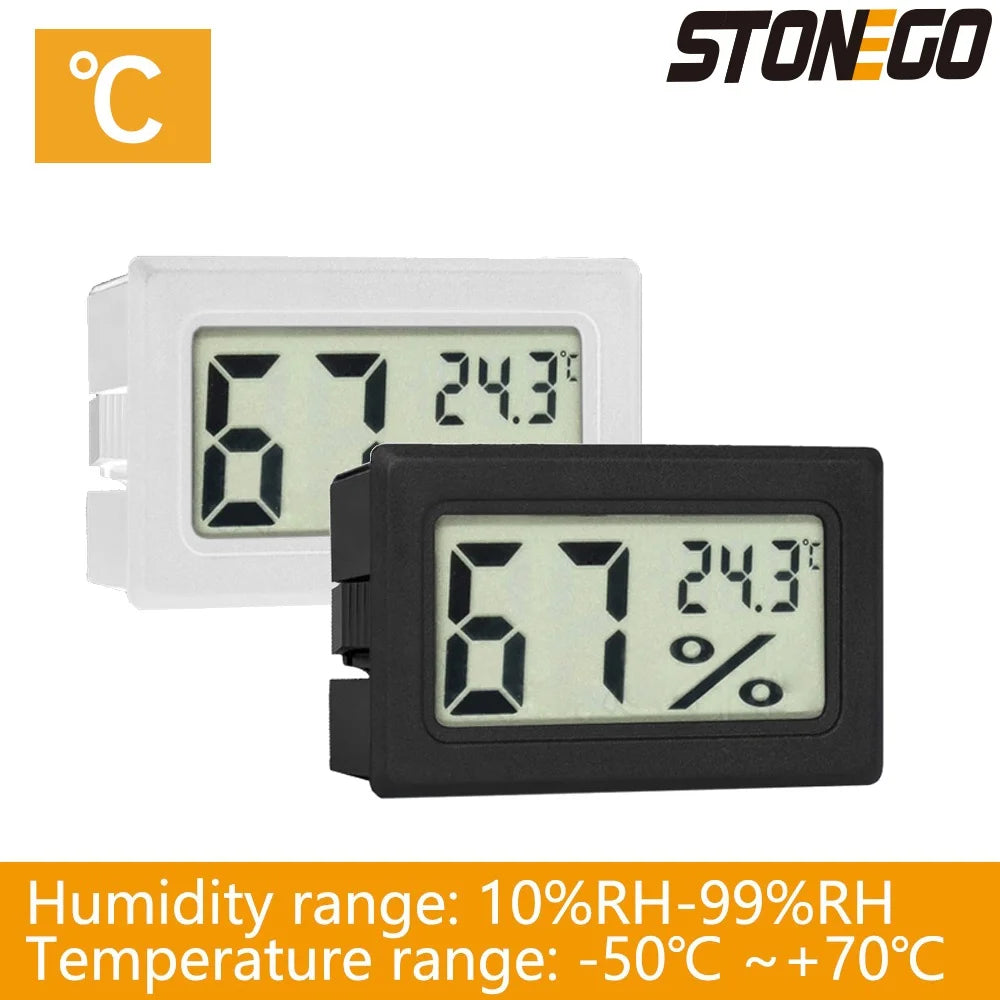 A white and black digital thermometer and hygrometer displaying 67 degrees and 24.3 degrees Celsius