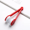A red portable microfiber glasses cleaning cloth with a brush is shown on a white background.