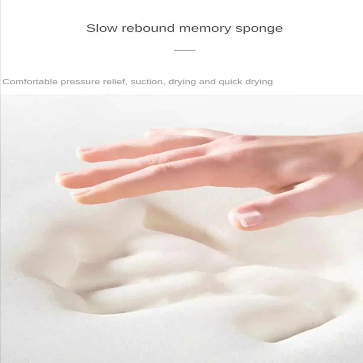 A hand is pressing into a white, fluffy memory sponge or bath mat to demonstrate its soft rebound and absorbency.