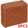 A stack of six rust-colored, raw-edge polyester cloth napkins.