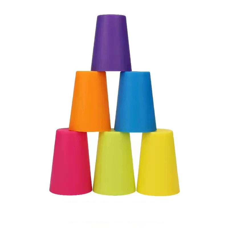 A stack of five brightly colored plastic cups in shades of purple, orange, blue, and pink.