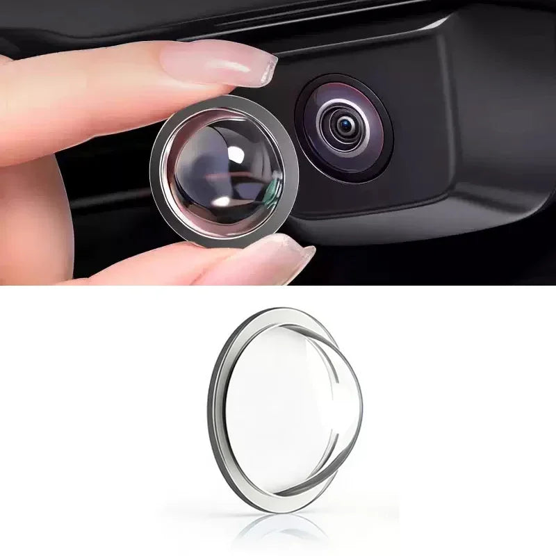A close-up view of a car camera lens protector, showing the clear glass lens and metal housing.