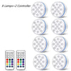A set of eight submersible LED pool lights and two controllers for underwater lighting.
