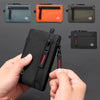 A hand holds a black RFID-blocking travel wallet with a carabiner clip, shown alongside various colored versions.