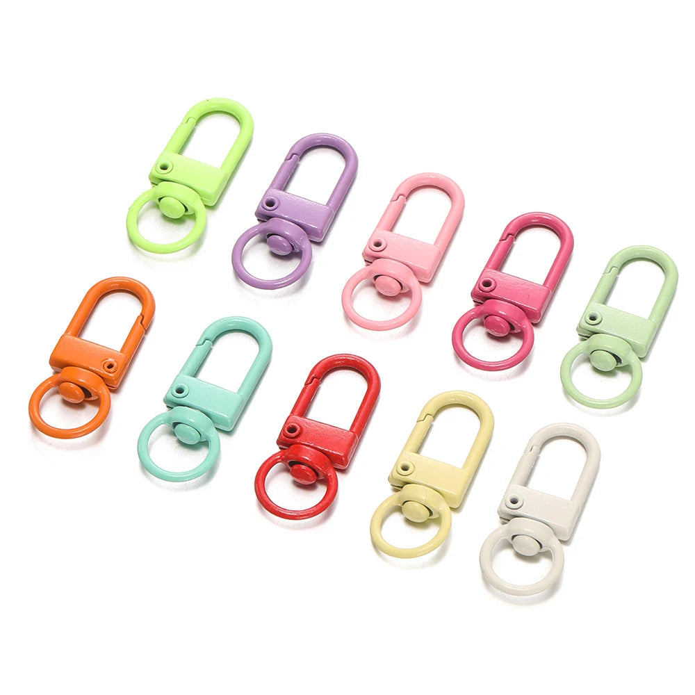 A collection of colorful alloy lobster clasp hooks in various shades including green, purple, pink, and orange.