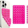 A white smartphone case and a pink suction cup phone mount with multiple silicone cups for hands-free use.