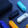 Various colored metal fidget sliders and a black box demonstrating a magnetic wave effect.