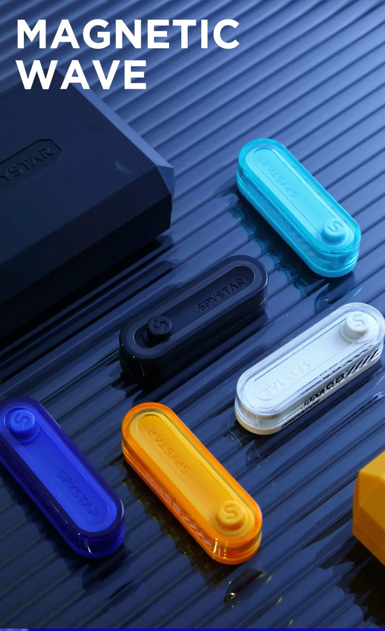 Various colored metal fidget sliders and a black box demonstrating a magnetic wave effect.