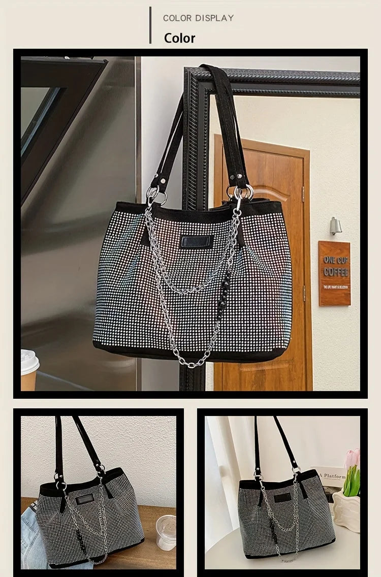 A black crystal-embellished chain shoulder bag hanging in front of a wooden door.