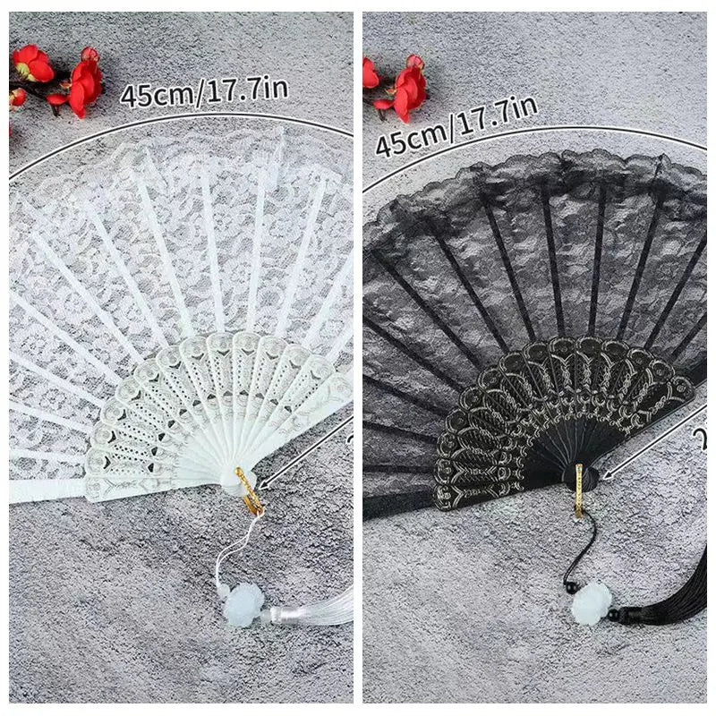 Vintage lace folding hand fan with a black and white design shown against a gray background.