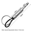 A silver vintage guitar amplifier wall key holder with a black cord and various measurement markings.
