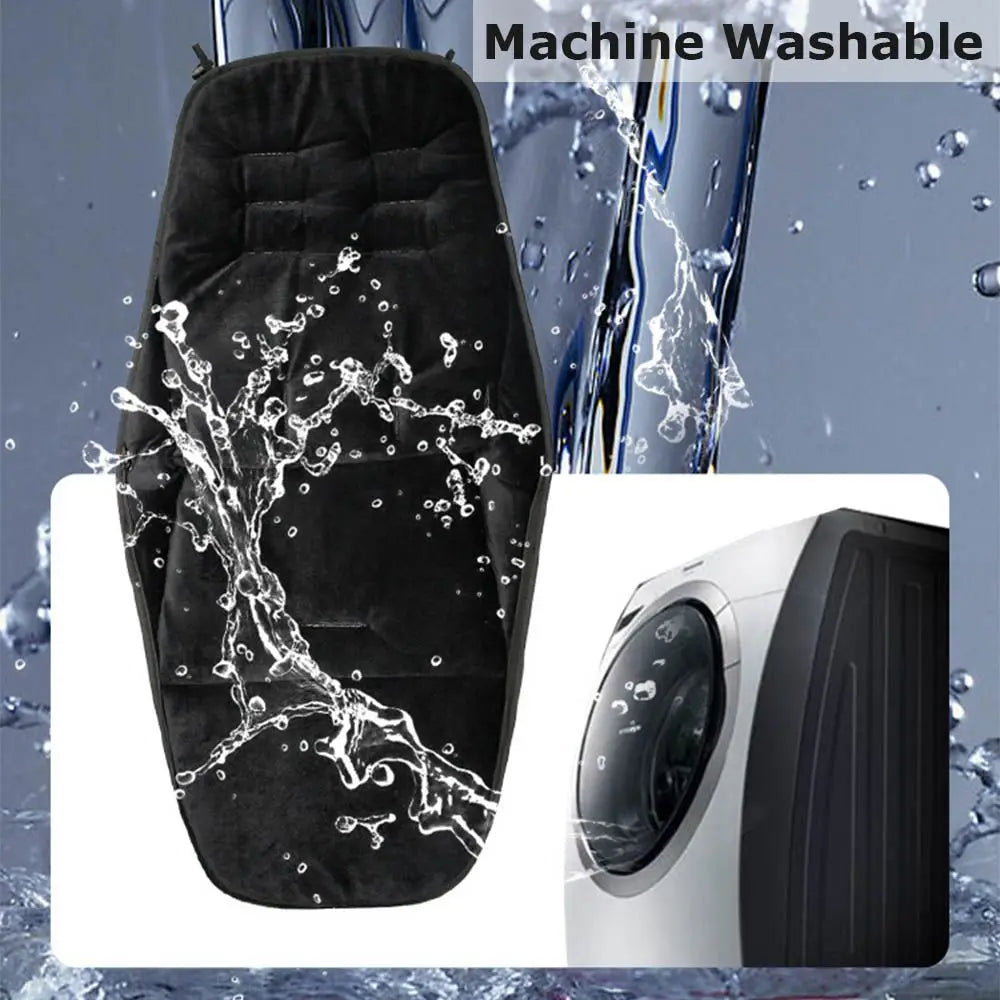 Black waterproof stroller sleeping bag being washed under running water.