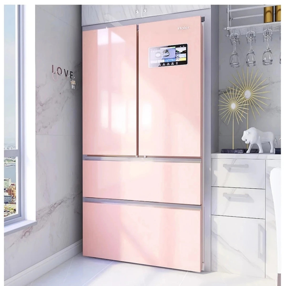 A modern kitchen cabinet with glossy pink doors and drawers set against a white marble wall.