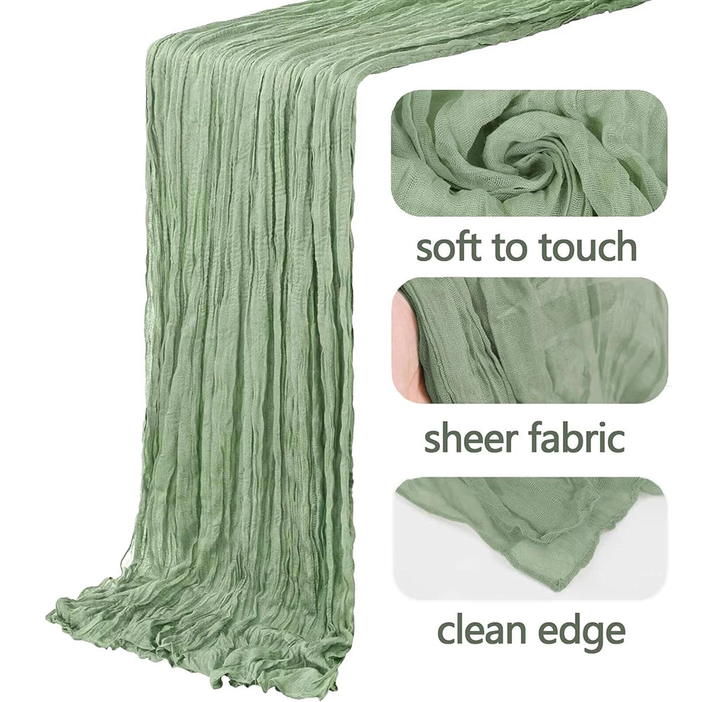 A vertical drape of sage green semi-sheer gauze fabric showing soft texture and clean edge.