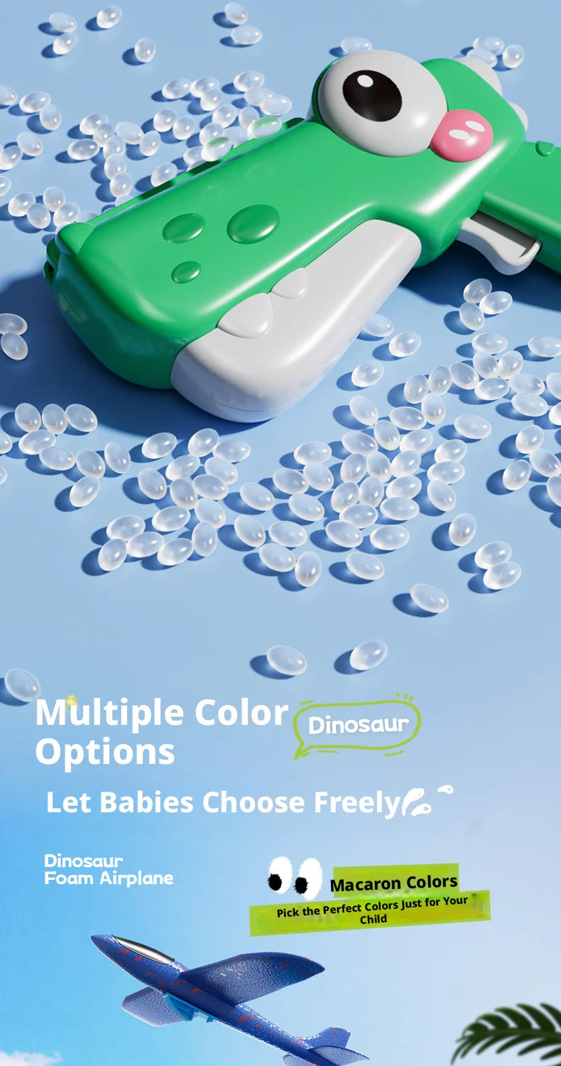 A green dinosaur foam airplane launcher toy with multiple color options scattered on a light blue background.