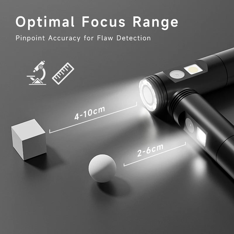 Industrial endoscope probe focusing light illuminating a small white cube and sphere for flaw detection