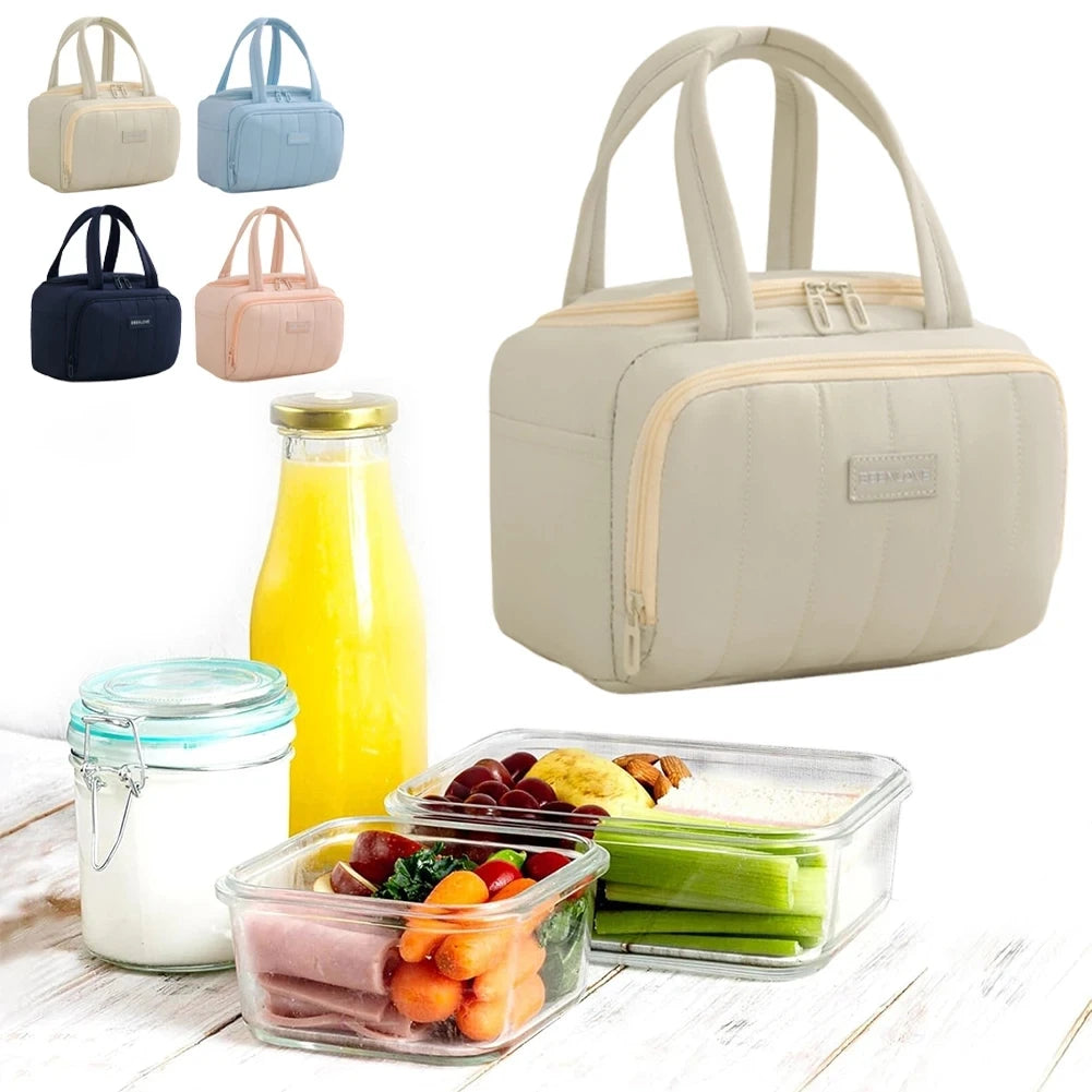 A collection of beige and blue insulated quilted lunch tote bags alongside various food containers on a wooden surface.