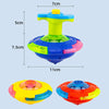 A glowing musical spinning top toy in yellow, blue, and orange colors shown from above and below.