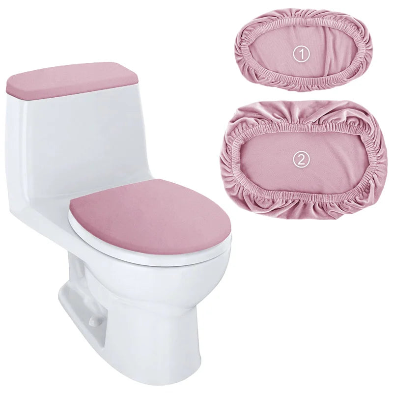 A white toilet with a pink stretchable seat and matching tank cover pads shown alongside the components.