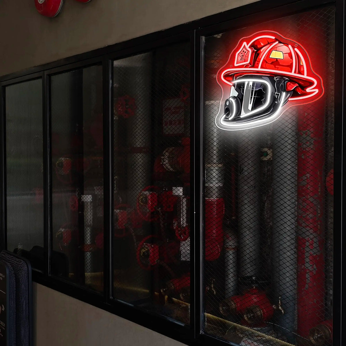 A neon sign of a firefighter helmet with the letter D glows red on a glass panel.