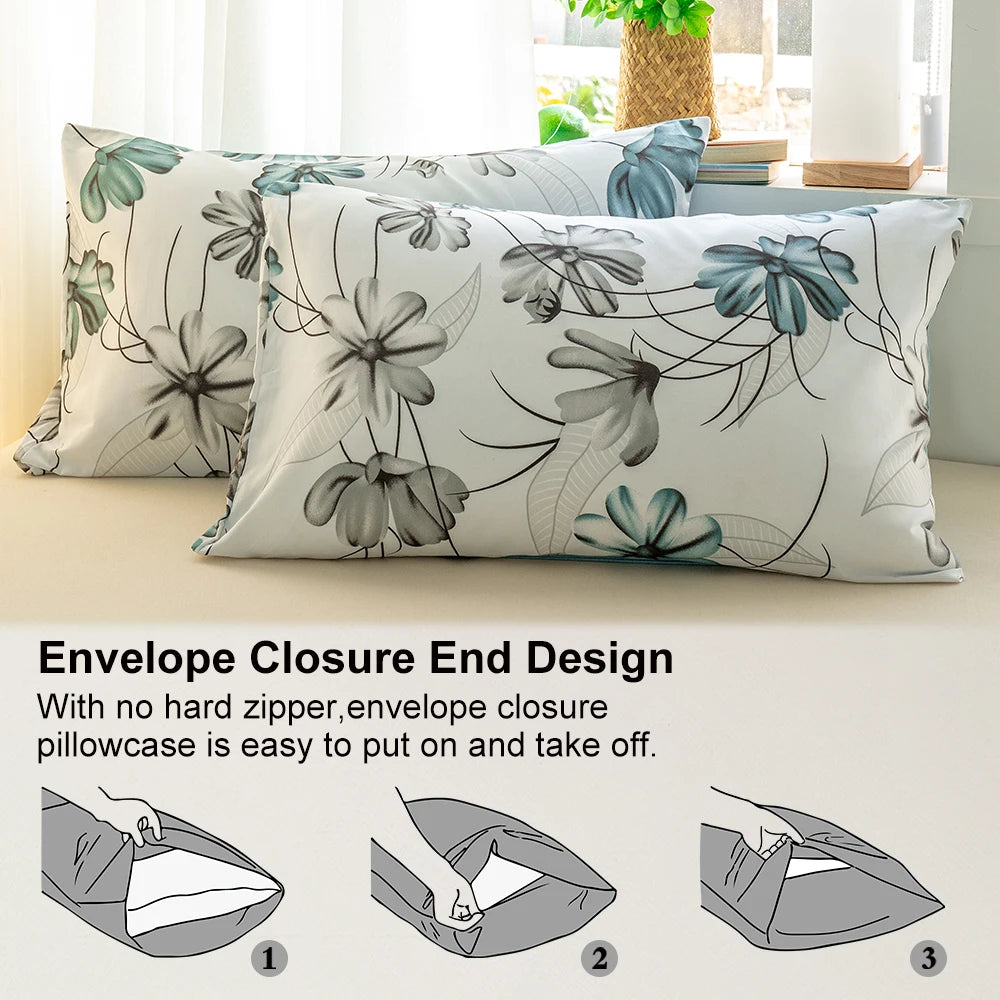A close-up of a pillowcase featuring a watercolor floral pattern in teal and grey tones, demonstrating an envelope closure de