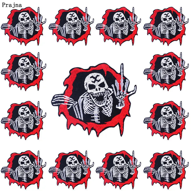 A set of ten embroidered iron-on patches featuring skulls and horror imagery on black fabric with red borders.
