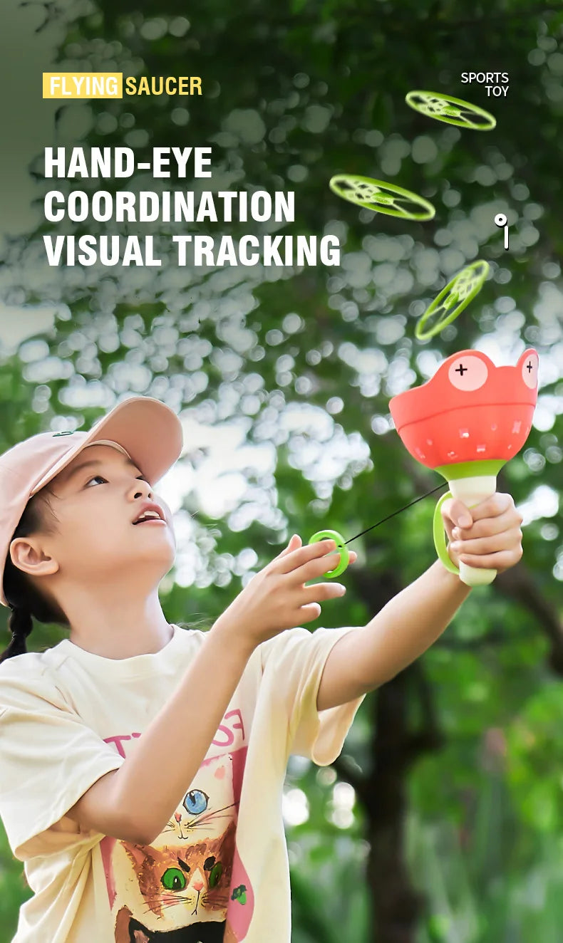 A young girl is playing with a hand-eye coordination visual tracking toy called the Flying Saucer.