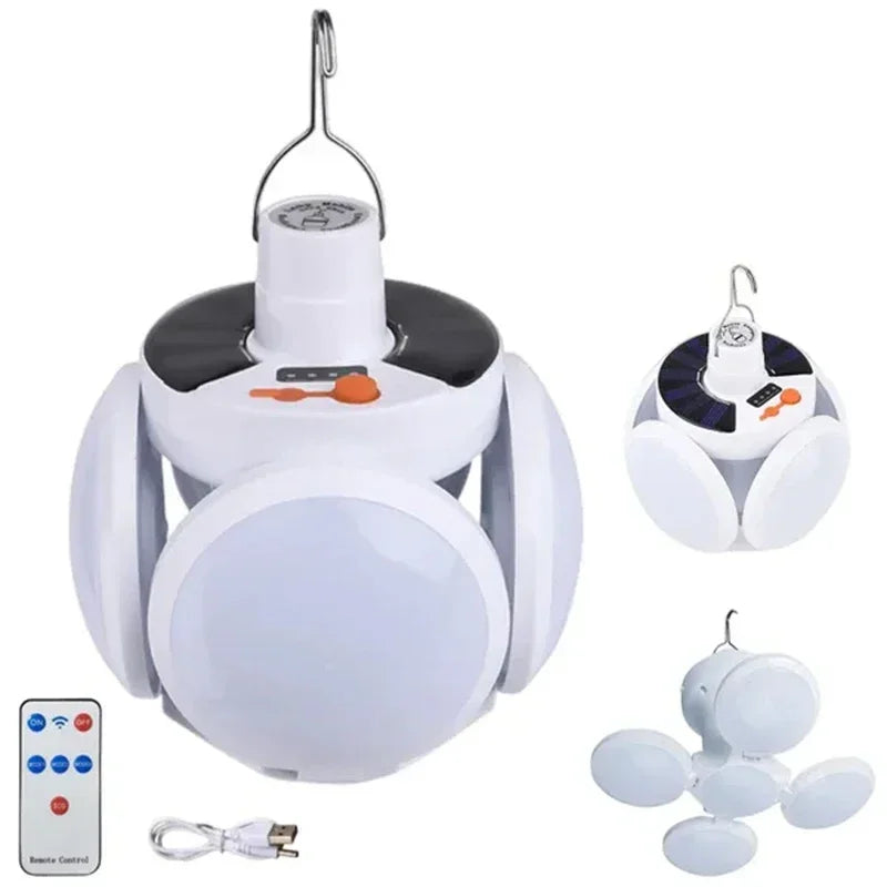 A white foldable solar camping lantern with a charging mechanism and remote control device.