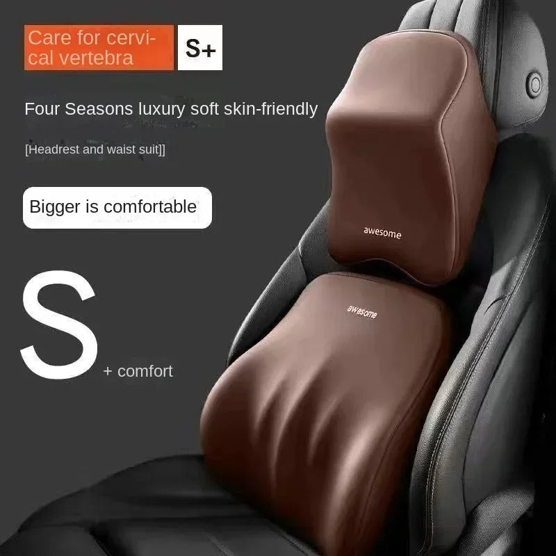 A close-up view of a brown memory foam car headrest and lumbar support pillow with S+ comfort markings.